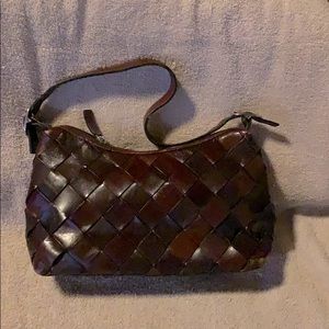 Wilson’s brown leather woven purse
